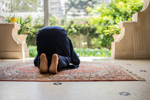 istock Young muslim man praying 1440493476
