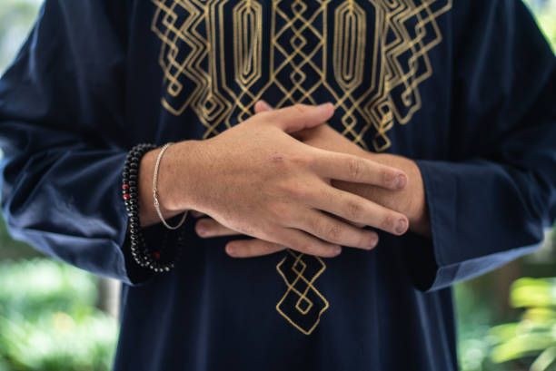 istock Mid section of a young man praying 1440493555