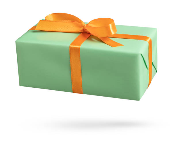 istock Green gift box with orange ribbon on white 1440493675