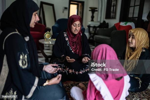 Muslim Women Praying At Home Stock Photo - Download Image Now - 10-11 Years, 35-39 Years, 45-49 Years