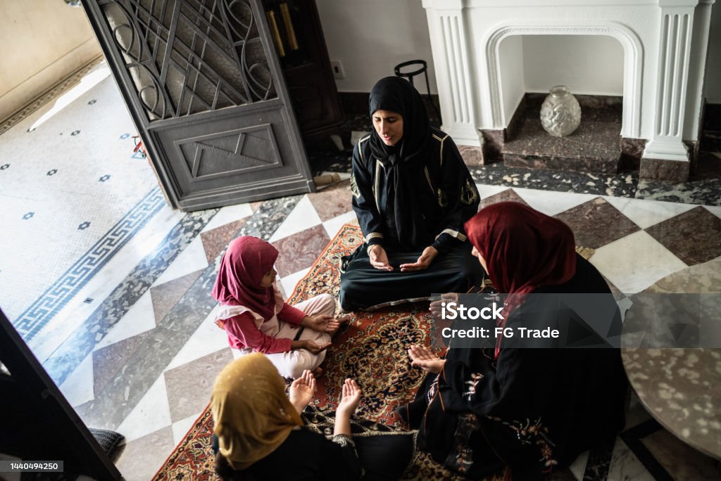 Muslim women praying at home 35-39 Years Stock Photo
