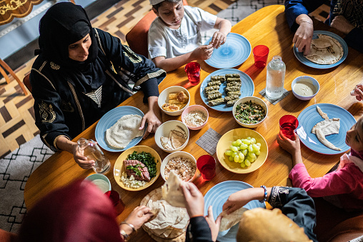 High angle view of a islamic family having lunch together at home