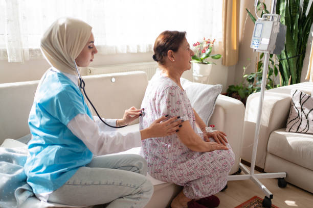 istock Health visitor and a woman during home 1440497145