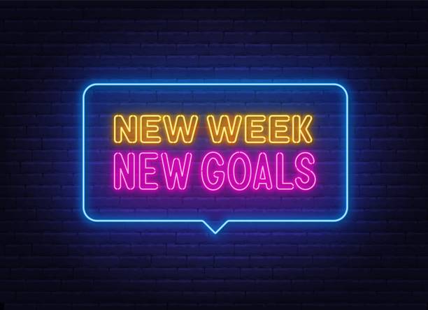 istock New Week New Goals neon quote on brick wall background. 1440497310
