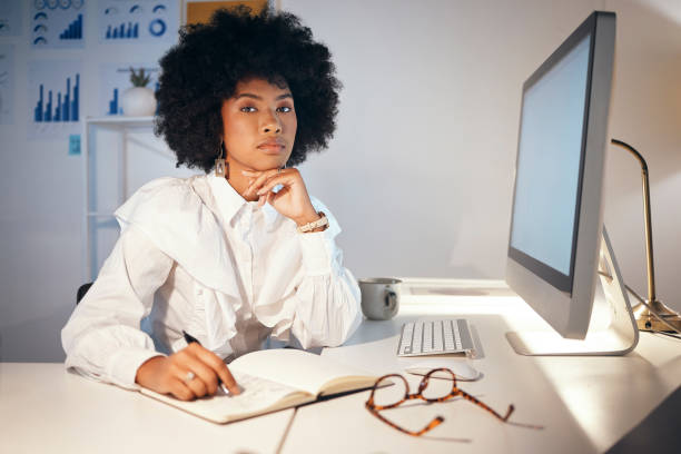 istock Corporate, black woman and business startup entrepreneur with computer data and office work notes. Portrait of a serious, young and professional working woman at a desk ready for tech research 1440497771
