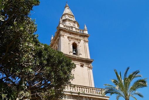 Church tower of Cattedrale di San Giovanni Battista (St. John Cathedral) in Baroque town Ragusa, Sicily, Italy.