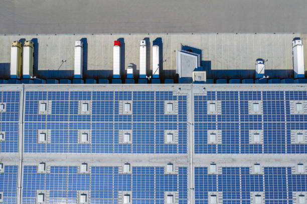 istock Aerial View of Cargo Containers and Distribution Warehouse with Renewable Energy Plants 1440501570