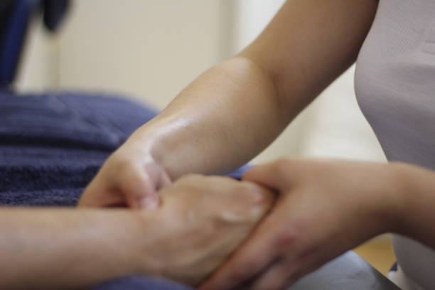 istock Massage therapist providing a patient with a hand massage 1440503120