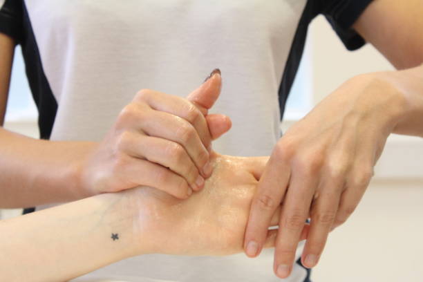 istock Massage therapist providing a patient with a hand massage 1440503143
