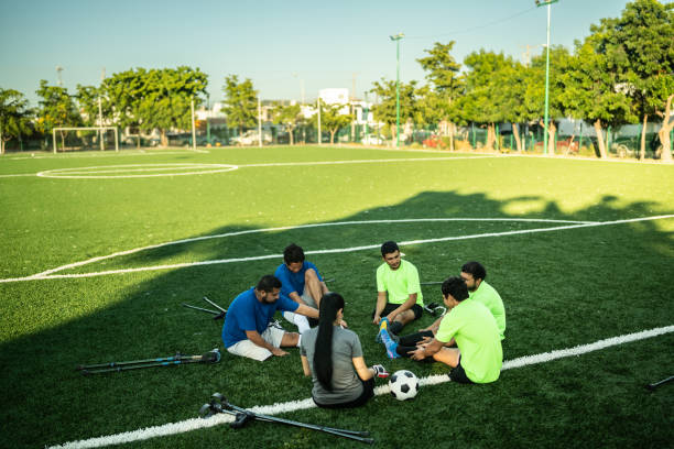istock Amputee soccer players getting ready on soccer field 1440503742