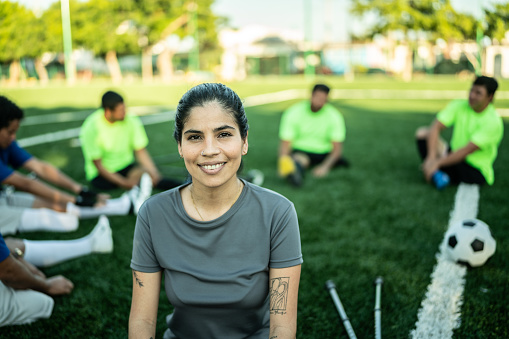 Portrait of a mid adult woman soccer player on soccer field