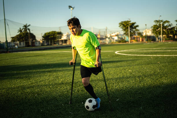 istock Young amputee player in a match on the soccer field 1440509598