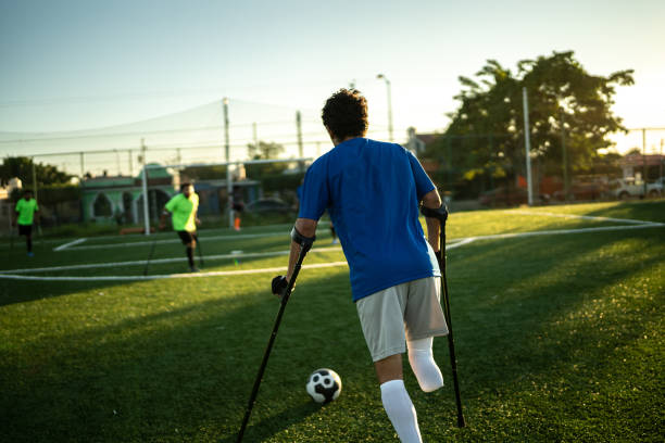 istock Young amputee player in a match on the soccer field 1440509880