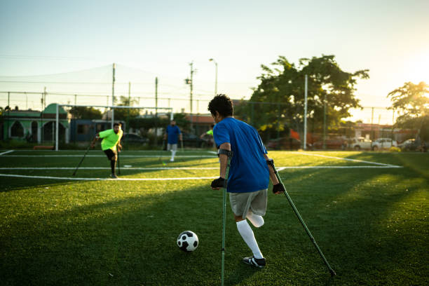 istock Young amputee player in a match on the soccer field 1440509903