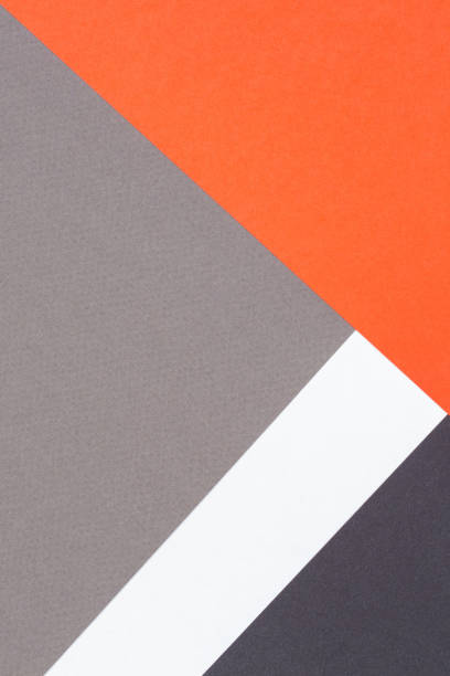 istock Creative abstract geometric paper background orange, white, light gray, black colors paper. Top view. Copy space 1440513916