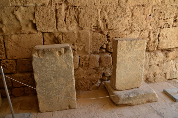 istock ancient stone flagstones isolated with brick wall on background, close-up 1440516689