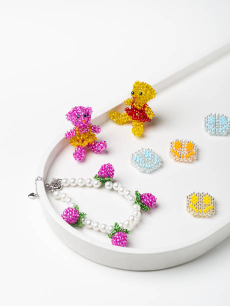 istock Handmade beaded products for kids on white plate 1440517440