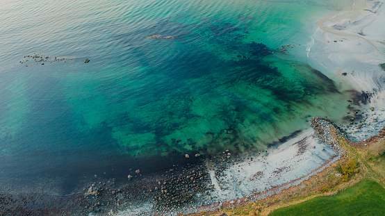 zenithal aerial drone view of a beach shore at dawn