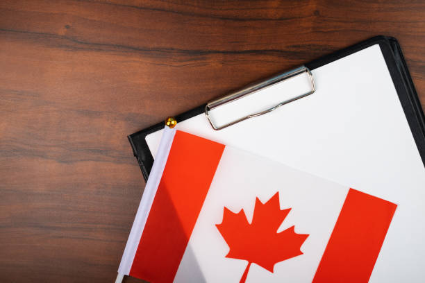 istock Canadian business document, contract management, deal, empty insurance blank, template for official agreement with Canadian flag 1440519201