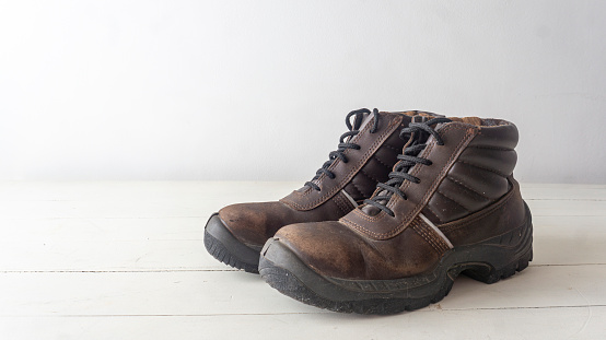 an old pair of men's shoes on a transparent background