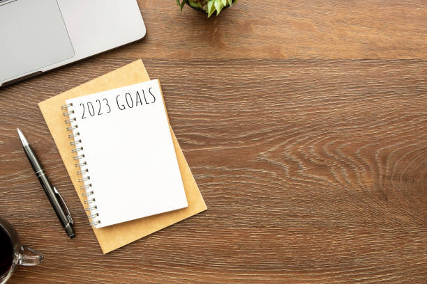 istock Notebook with 2023 goals text on it to apply new year resolutions and plan. 1440522376