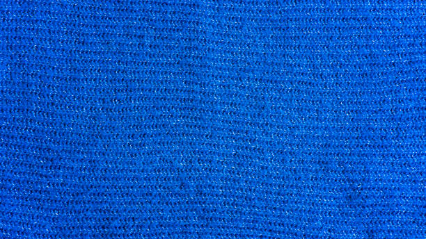 Knitted seamless background with copyspace. Blue and green sweater pattern for Christmas or winter design. stock photo