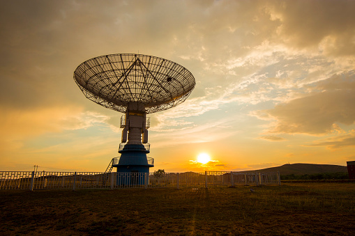 Radio telescope on sunset