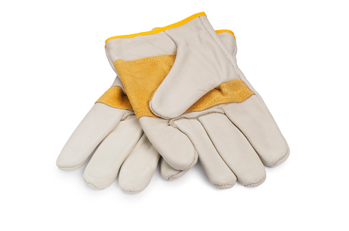 Studio shot of a pair of gardening gloves cut out against a white background
