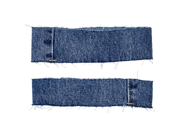 Pieces of jeans fabric with fringe isolated on white background. Two cut-off pant leg pieces of a blue denim jeans. Macro. Pieces of jeans fabric with fringe isolated on white background. Two cut-off pant leg pieces of a blue denim jeans. Macro. Frayed stock pictures, royalty-free photos & images