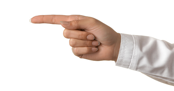 Woman doctor's hand shows finger to the side on white isolated background. hand gestures