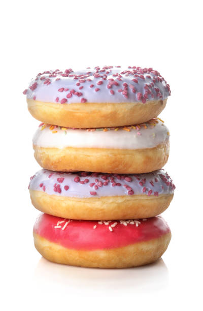 istock Sweet donut with icing and sprinkling in a stack close-up on a white isolated background 1440531698