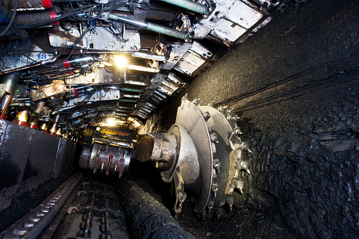 Longwall Mining: Shearer, with two rotating cutting drums and movable hydraulic powered roof supports called shields