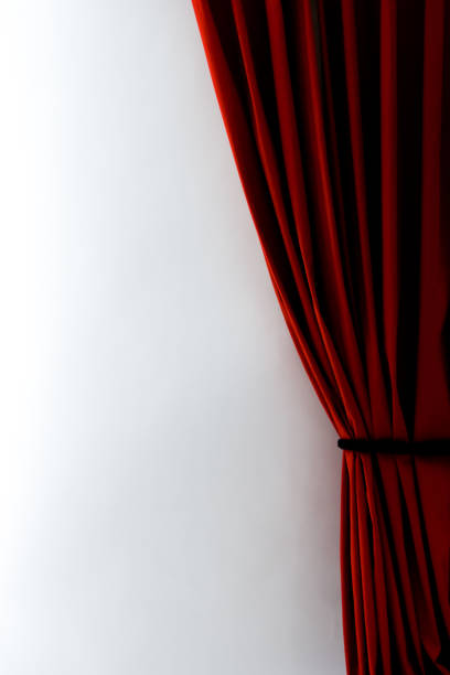 istock Vertical shot of red curtains with a white wall 1440532218