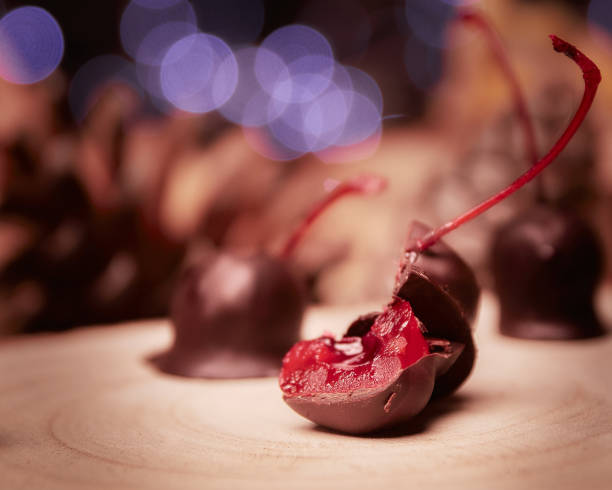 istock Selective focus shot of chocolate-covered cherries with bokeh background 1440532388