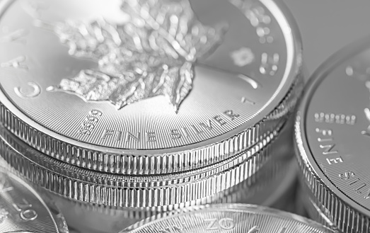 A closeup shot of maple leaf fine silver coins from the Royal Canadian Mint