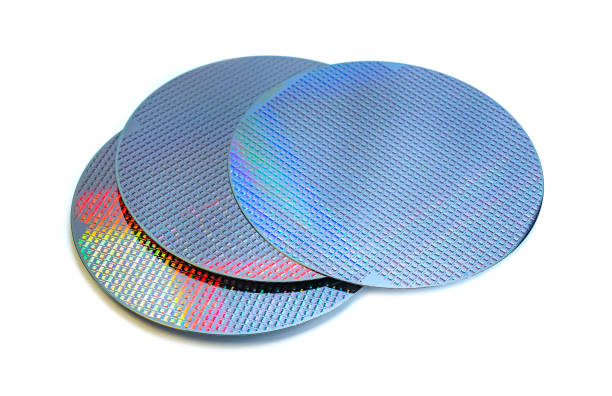 istock Silicon wafer with chips isolated on white background 1440534888