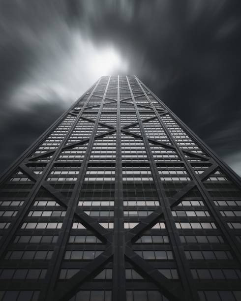 istock Front view of a huge skyscraper with dramatic weather 1440535850