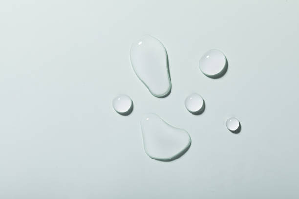 istock High angle shot of waterdrops on a blue surface 1440536462
