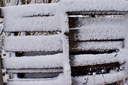 snow covered wood pallet up close