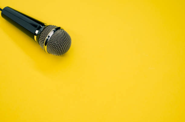 istock High angle shot of a microphone on a yellow surface 1440537290