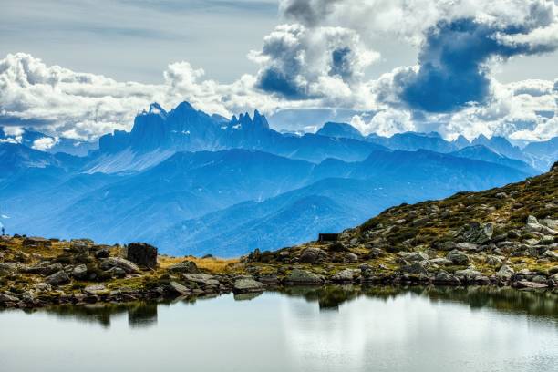 istock Beautiful view pf the Dolomite mountains under a cloudy blue sky 1440537791