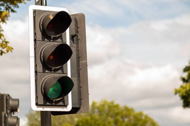 istock Closeup of traffic light post showing green 1440538014