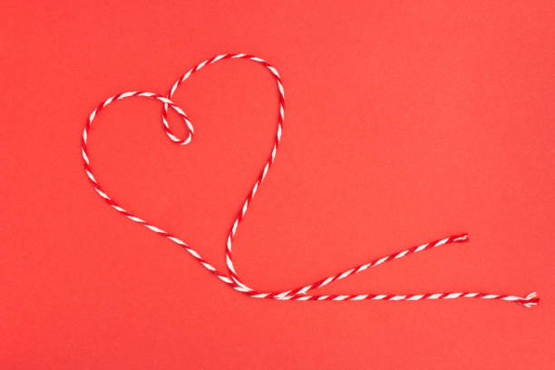 A red and white heart shape thread for a Valentine background