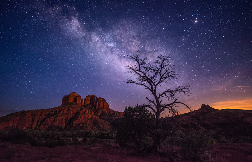 A beautiful shot of the Cathedral Rock under the stars, Milky Way on the night starry sky