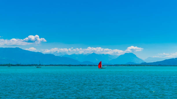 Germany, Beautiful panorama view bodensee blue lake water austrian swiss coast from lindau, sailboats lake sunny day vacation stock photo