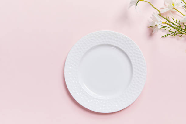 istock Closeup shot of a white plate on a colored background 1440540362