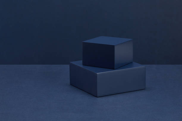 istock Closeup shot of different size cubes on dark background 1440540671
