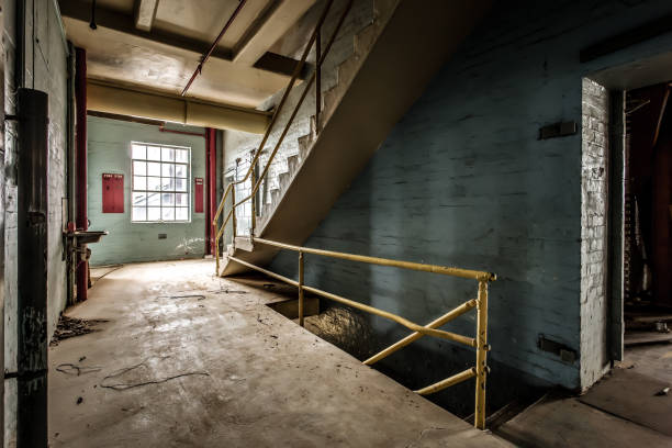 istock Abandoned building with industrial spooky stairs 1440540921
