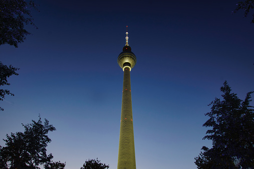 A low angle shot of the Stuttgart TV Tower at night