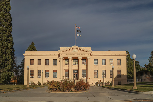 Independence, California, United States – November 19, 2020: The Inyo County Courthouse in California's Eastern Sierra area reflects a warm evening sunset.
